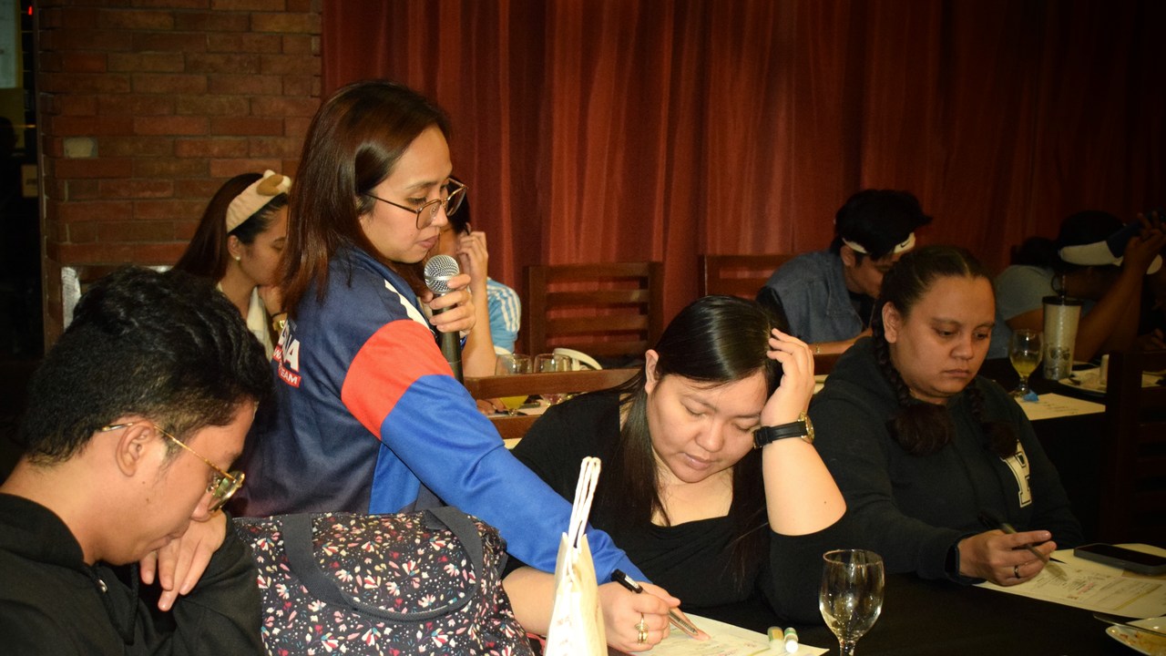 Chelsea Pineda-Astrologio guiding professionals as they work through a small-group learning activity.